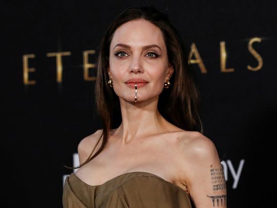 Cast member Angelina Jolie poses at the premiere for the film 