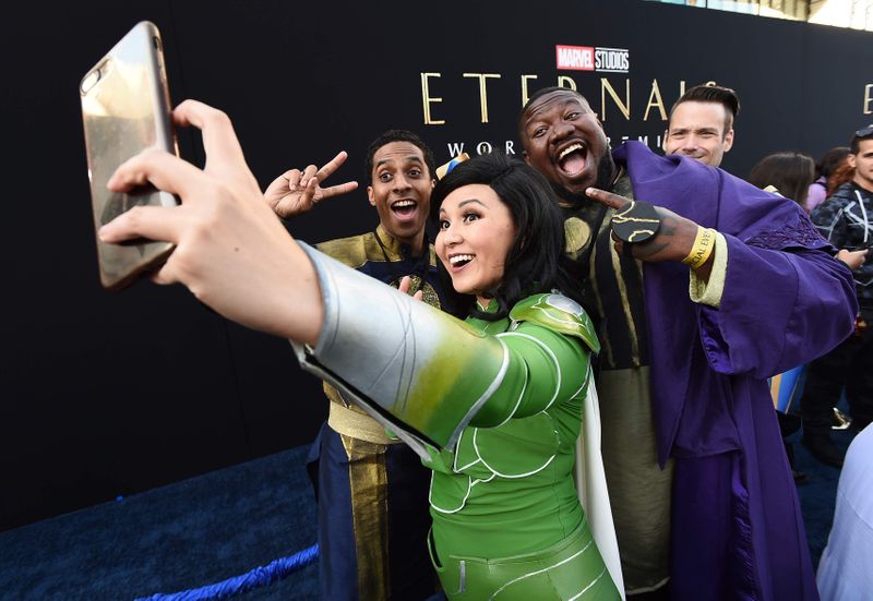 Fans dressed as characters are seen at the premiere of 
