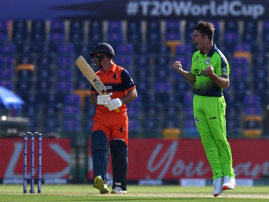 Ireland's Curtis Campher celebrates the dismissal of Netherland's Ryan ten Doeschate in Abu Dhabi
