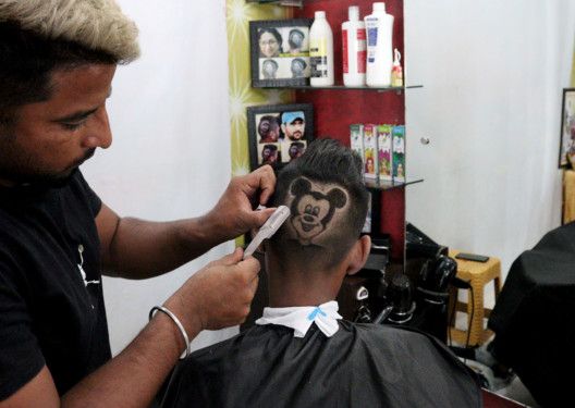 Copy of 2021-10-20T010230Z_771503205_RC278Q914G6C_RTRMADP_3_INDIA-BARBER-HAIRCUT-1634715409437