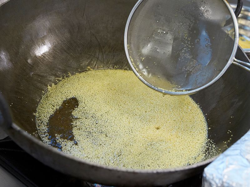 Frying boondi in ghee or clarified butter