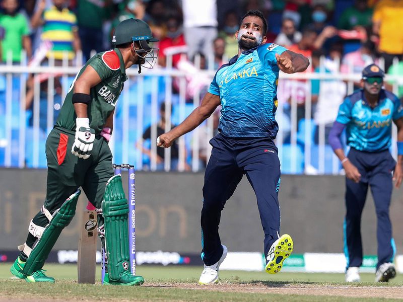 Sri Lanka's Chamika Karunaratne bowls during the Twenty20 World Cup match against Bangladesh in Sharjah