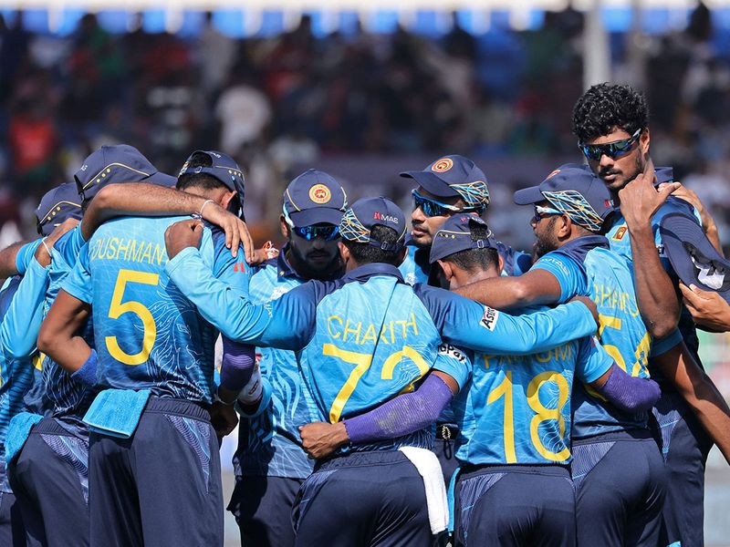 Sri Lankan players huddle before the start of the Twenty20 World Cup match against Bangladesh in Sharjah
