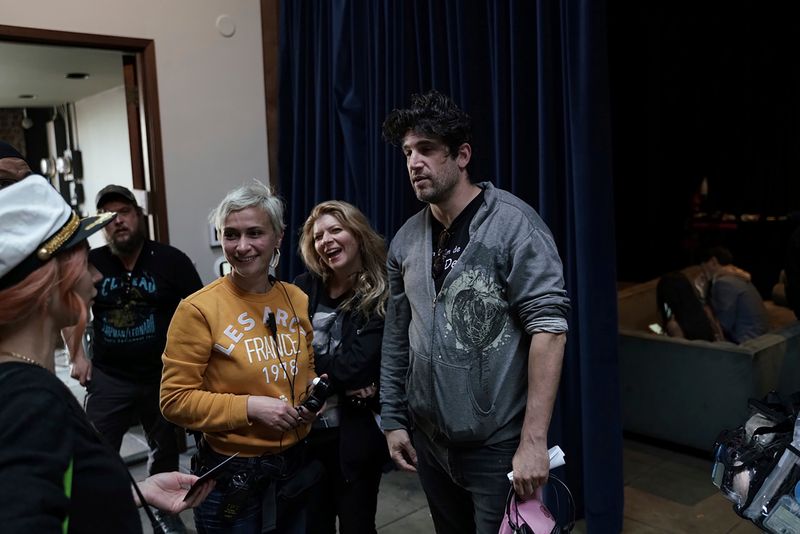 This photo provided by Jack Caswell shows director of photography Halyna Hutchins, third from left, director's assistant Izzy Lee, and director Adam Egypt Mortimer on the set of 