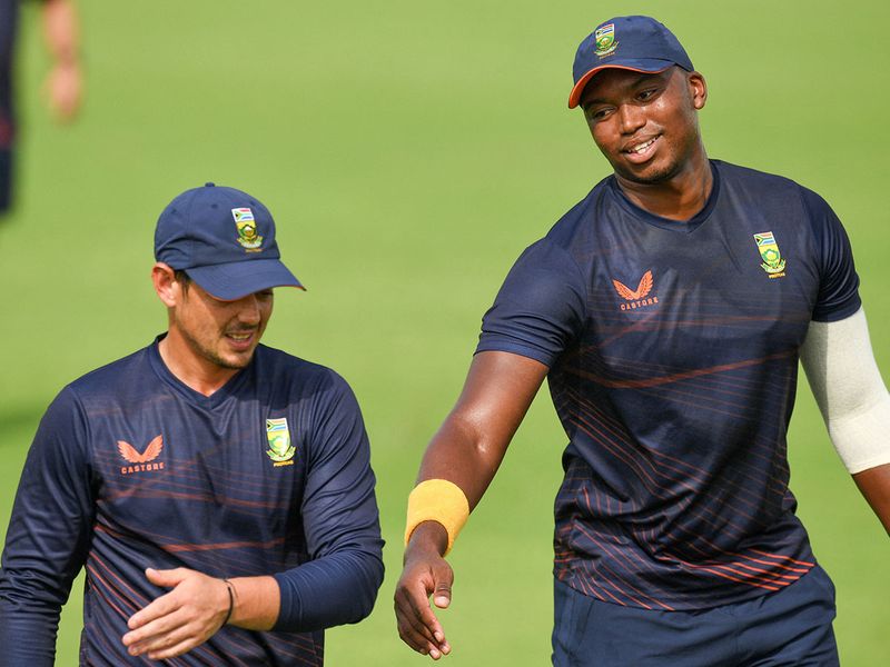 South Africa's Quinton De Kock and teammate Lungi Ngidi 