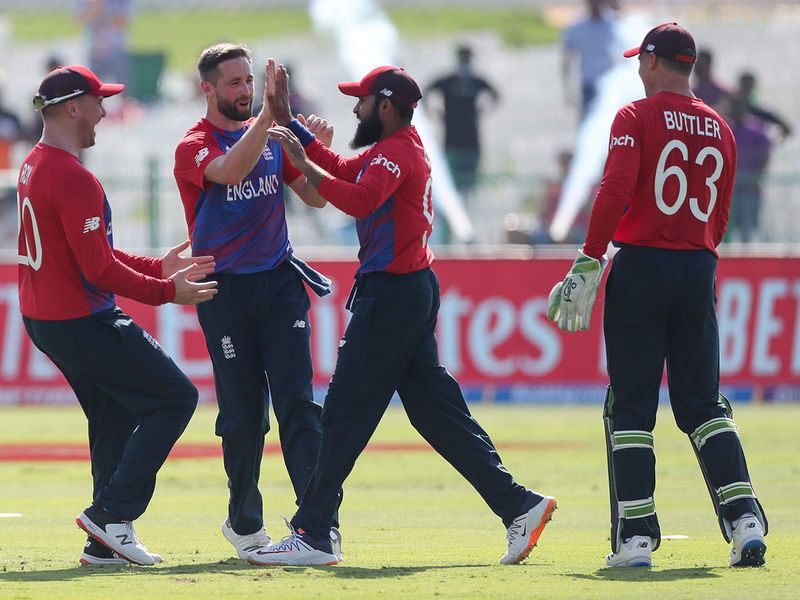 England's Adil Rashid, second right, is congratulated by teammates after taking a catch to dismiss Bangladesh's Shakib Al Hasan 