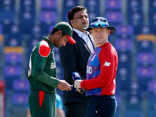 England's Eoin Morgan and Bangladesh's Mahmudullah before the match IN aBU DHABI