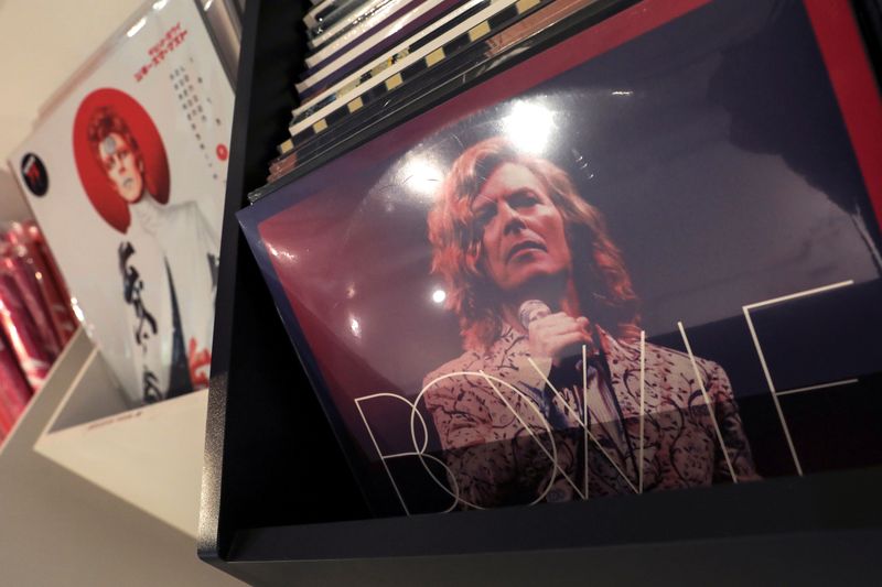 Albums by the late rock and roll artist David Bowie for sale are pictured inside 