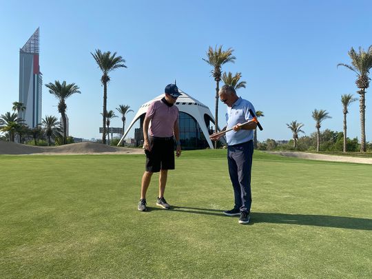 The European Tour's Graeme MacNiven (right) with Golf Course Superintendent Matt Perry inspecting the 8th Green on the Majlis Course at Emirates Golf Club just prior to the recent reopening of the golf course.