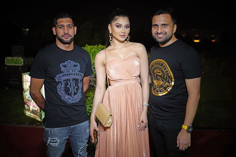 From left: Professional boxer Amir Khan, actress Urvashi Rautela and Adel Sajan, Managing Director Danube Group at the Filmfare Achievers Night afterparty in Dubai. 