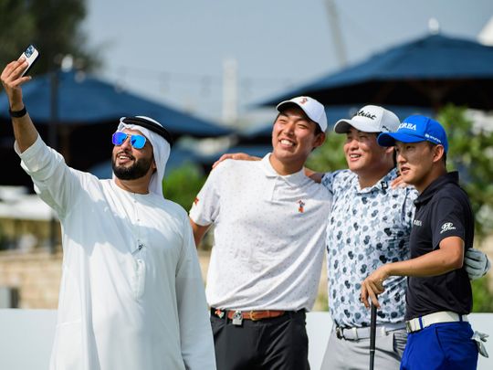 Abdulwahed Al Qasem poses for a selfie with Bo Jin, Sam Choi and Baekjun Kim