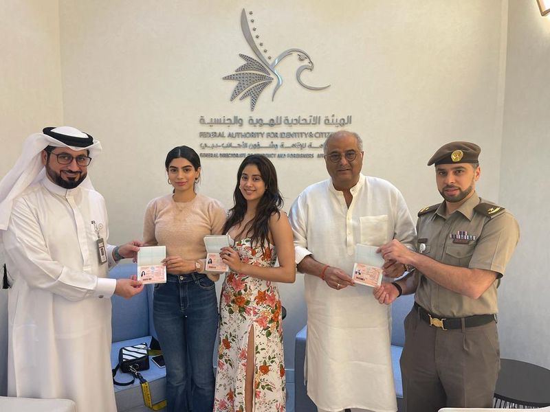 Boney Kapoor with daughters Janhvi and Khushi as they receive the UAE golden visa