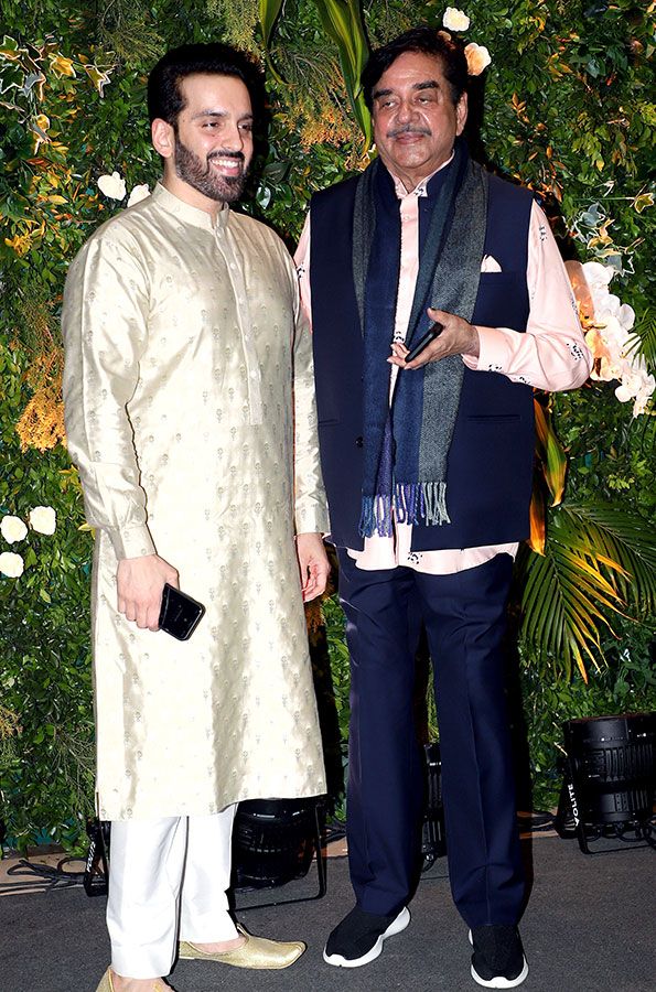 Bollywood actor Shatrughan Sinha with his son poses for a picture at actor Aditya Seal and actress Anushka Ranjan's Sangeet ceremony, at Juhu, in Mumbai on Saturday. 