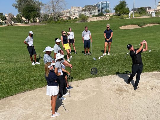 Peter Cowen, right, holds a workshop for his Academy pros in Dubai