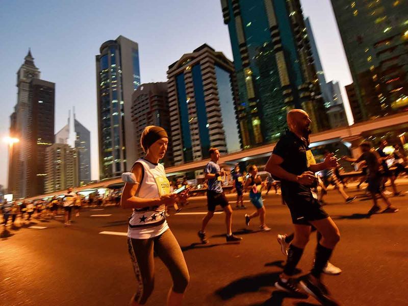 Residents taking part in the Dubai Run 30x30 on Sheikh Zayed Road