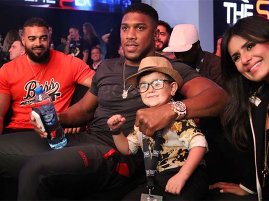 Anthony Joshua watches the action at the D4G Fight Night in Dubai