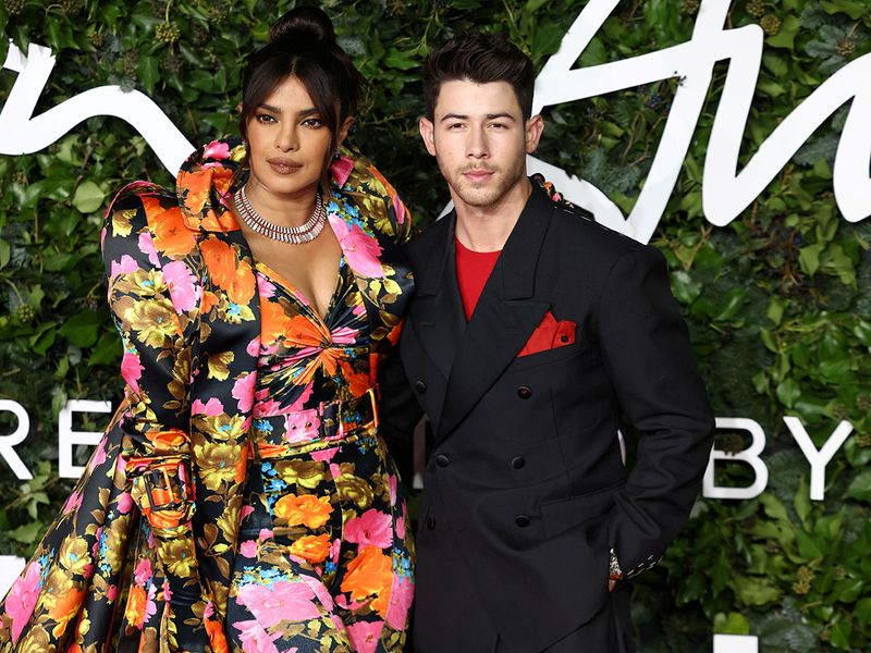Priyanka Chopra and Nick Jonas pose on the red carpet at the Fashion Awards/