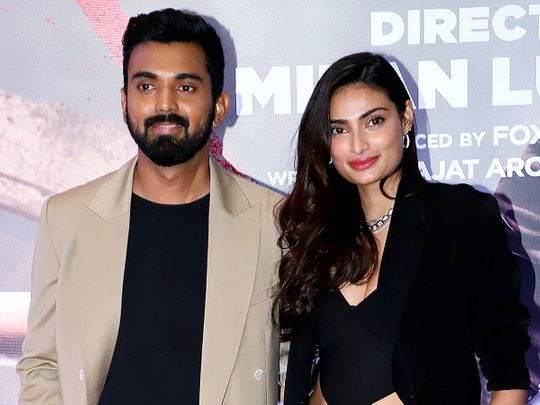 Bollywood actress Athiya Shetty with cricketer KL Rahul pose for a photo at the special screening of the movie 
