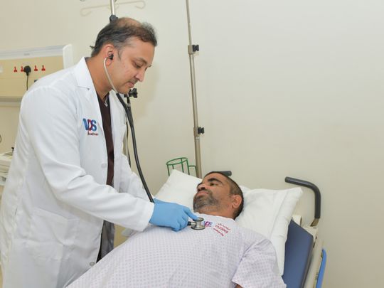 Dr Niyas Khalid examining Nitesh Sadanand Madgaocar at Burjeel Medical City during a follow up check up (1)-1638853264280