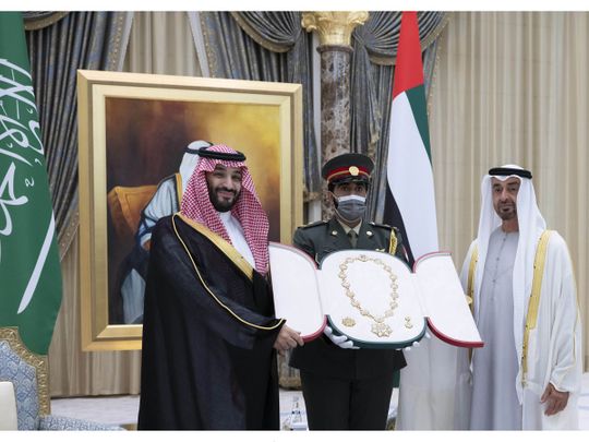 His Highness Sheikh Mohamed bin Zayed Al Nahyan, Crown Prince of Abu Dhabi and Deputy Supreme Commander of the UAE Armed Forces presents the Order of Zayed medal to Saudi Crown Prince Mohamed bin Salman, during an official reception at Qasr Al Watan yesterday.