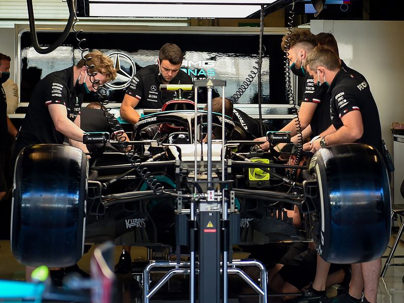 Mercedes' pit crew get to work on Lewis Hamilton's car