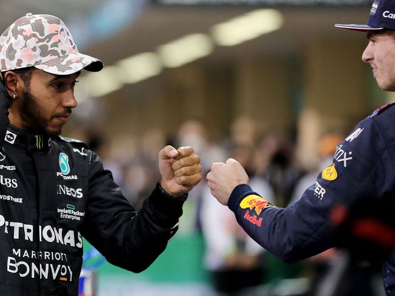 Lewis Hamilton bumps fists with Max Verstappen after the Dutchman took pole in Abu Dhabi
