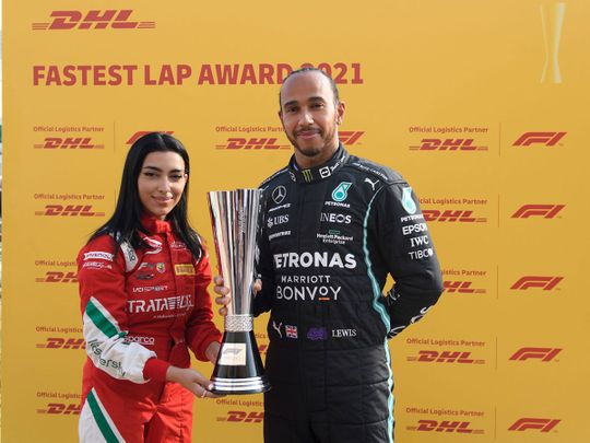 Amna Al Qubaisi presents Lewis Hamilton with his Fastest Lap award in Abu Dhabi