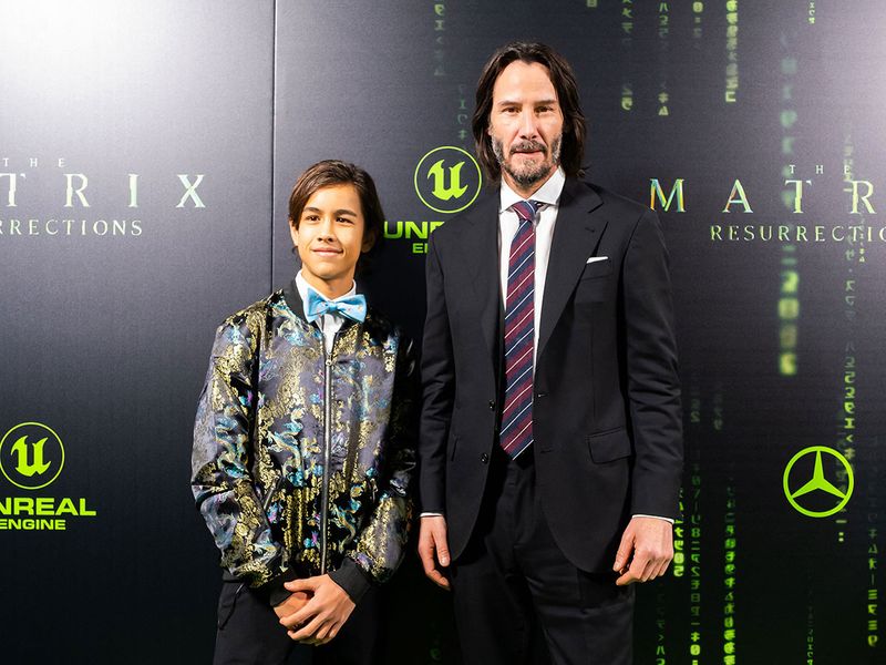 Canadian actor Keanu Reeves (R) arrives for the premiere of 