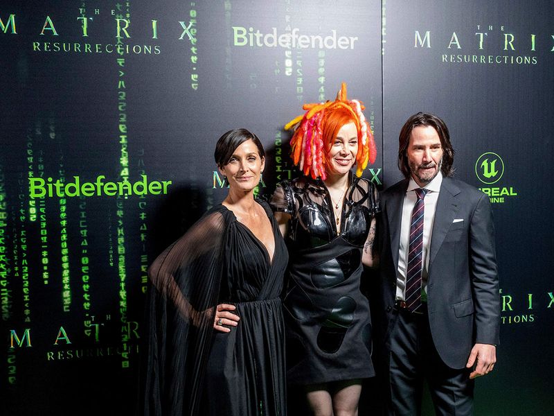 Carrie-Anne Moss, from left, Lana Wachowski and Keanu Reeves arrive at the premiere of 