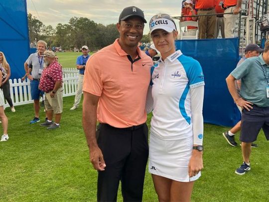 Nelly Korda with Tiger Woods