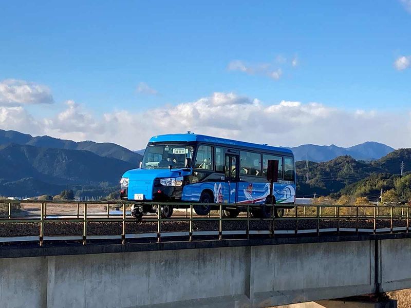 A 'Dual-Mode Vehicle (DMV)' bus that can run both on conventional road surfaces and a railway track, is seen during its test run in Kaiyo Town, Tokushima Prefectue, Japan
