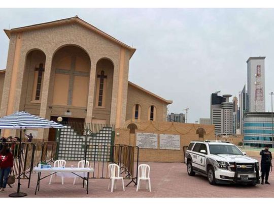 Security personnel on duty outside a church in Kuwait. 