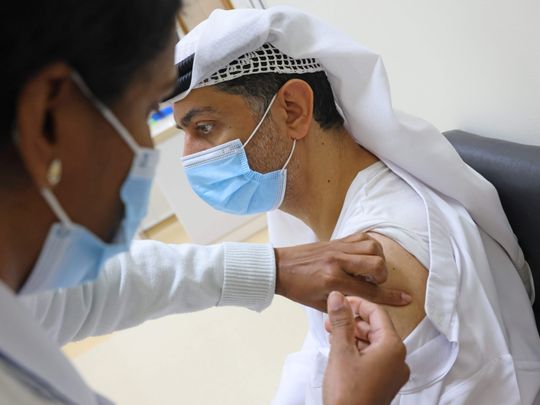 In Pictures: Dubai residents queue up to receive COVID-19 vaccination ...