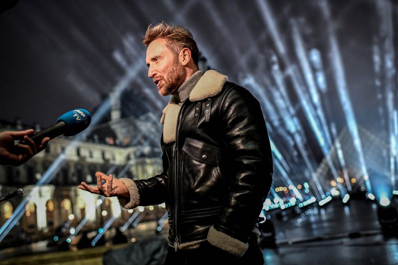 Photos DJ David Guetta records hourlong NYE show in front of Louvre Museum Entertainment