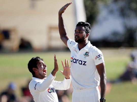 Bangladesh's Ebadot Hossain, right, celebrates with teammate Mehidy Hasan Miraz 