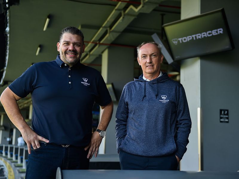 Top Golf CEO Chris May, right, and Director of Operations Mike Walton