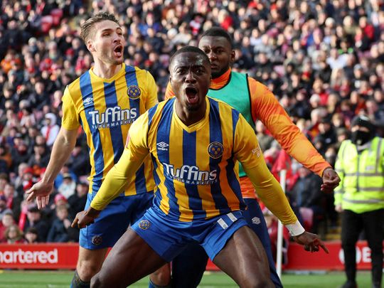 Shrewsbury Town's Daniel Udoh celebrates scoring against Liverpool