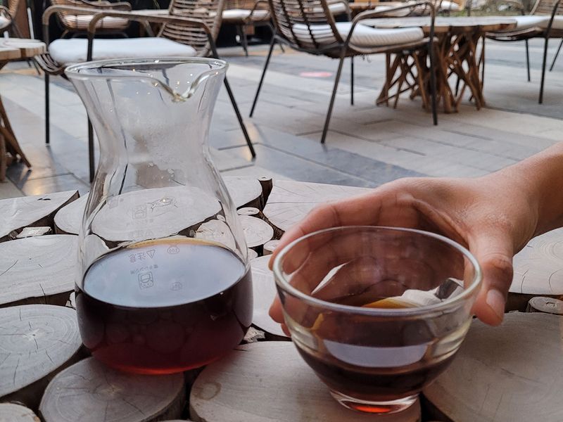 A V60 coffee being served 