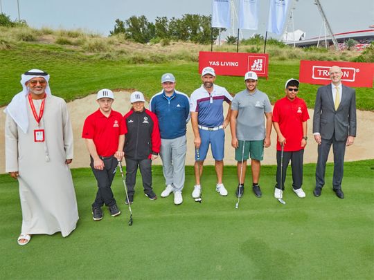 Padraig Harrington, centre, with the UAE Special Olympics golfers, Talal Al Hashimi, National Director of Special Olympics, and Greg Fewer, CFO - Aldar Properties, at the Special Olympics Golf Clinic at Yas Links