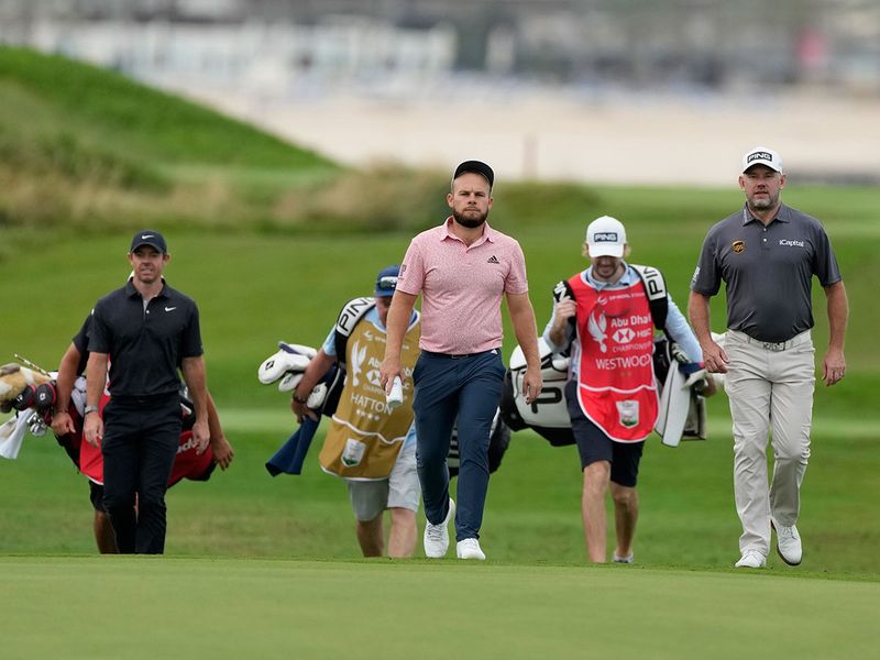 Rory McIlroy, Tyrrell Hatton and Lee Westwood during the Abu Dhabi HSBC Championship first round