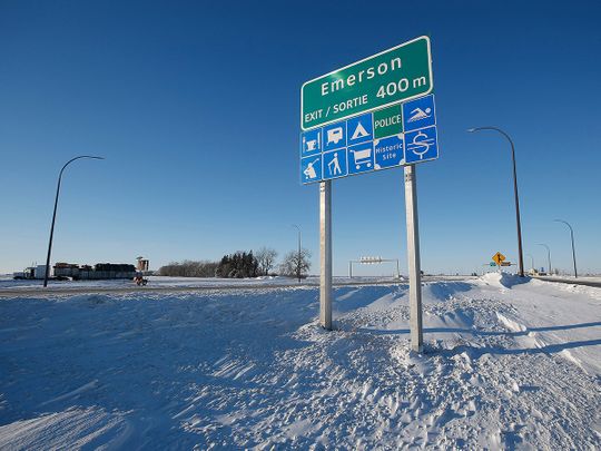 Road signage is posted just outside of Emerson, Manitoba