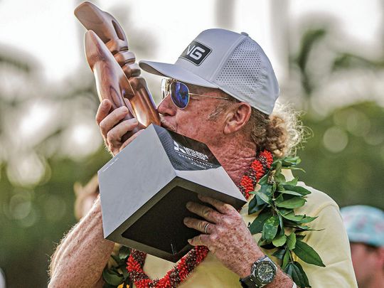 Miguel Angel Jimenez kisses the trophy after winning the PGA Tour Champions' Mitsubishi Electric Championship 