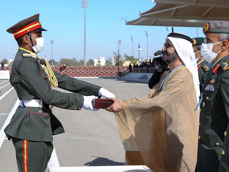 Sheikh Mohammed with a graduated cadet 