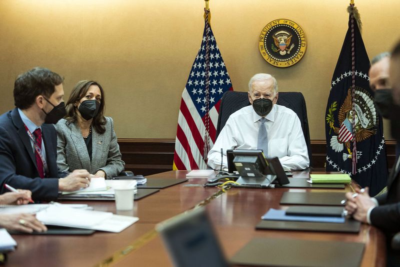 In this image released by The White House, US President Joe Biden and Vice President Kamala Harris with the President’s national security team in the Situation Room, monitor the counterterrorism operation in Syria, in Washington, DC, on February 3, 2022. 
