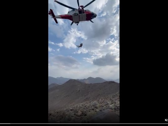 A screenshot of a National Search and Rescue Centre video showing the evacuation mission of the injured man in Wadi Al Hilo in Sharjah emirate on Sunday