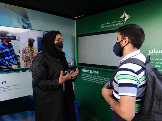 Dr Ayesha Al Basti with a visitor at 'Mindspire' event at Expo-1644841205236