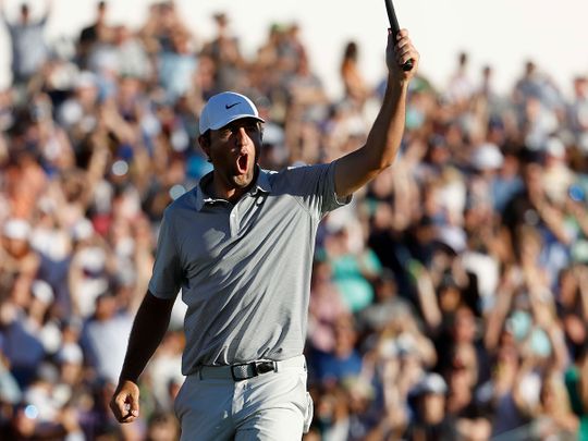 Scottie Scheffler celebrates after winning the the WM Phoenix Open