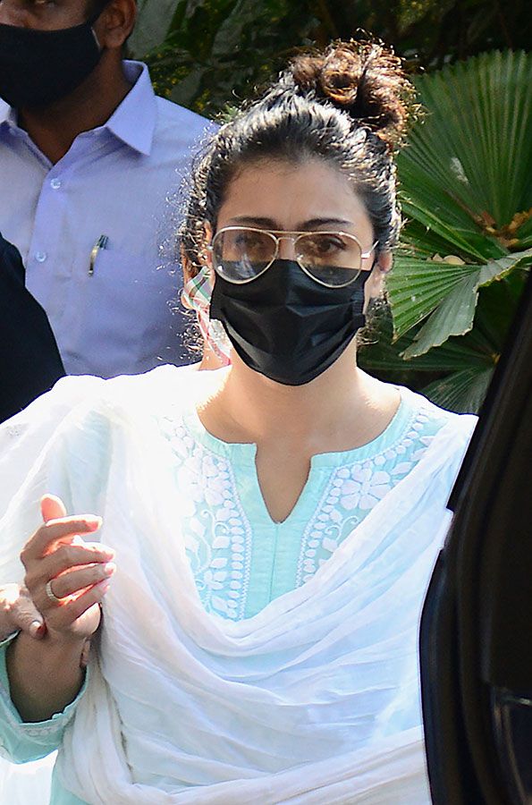 Bollywood actress Kajol Devgn arrives to pay her respect at the residence of late Bollywood singer-composer Bappi Lahiri in Mumbai on February 16, 2022. 