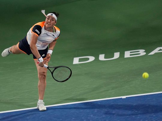 Ons Jabeur in action against Simona Halep at the Dubai Duty Free Tennis Championships 