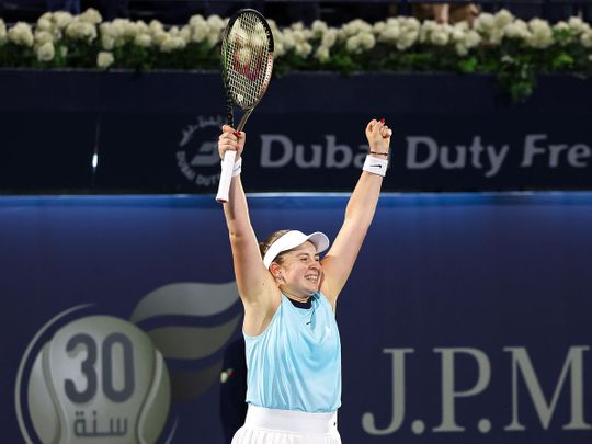 Jeļena Ostapenko celebrates after defeating Veronika Kudermetova in the Dubai Duty Free Tennis Championships final